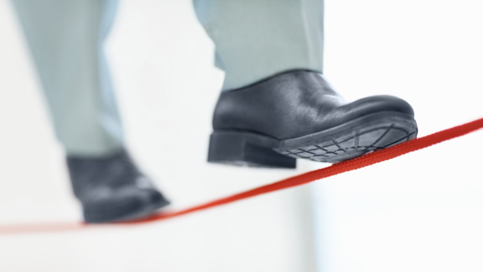 a man walking on a tightrope