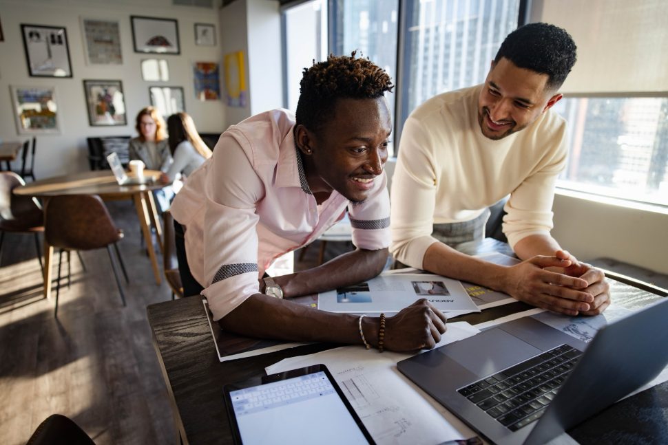 Two people working on an LMS.